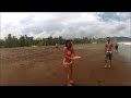 Girl catches frisbee without looking in Jaco, C.R.