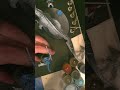 Painting a tiny blue dinosaur man