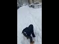 My son playing with the snow