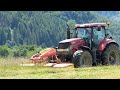 Mowing grass for hay on the hill with a CASE IH PUMA 210 tractor and Pöttinger & Krone scythes