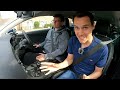 Driving Instructor Teaching a Pupil to Deal with Traffic Lights in Great Britain