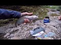 trout fishing with powerbait on a river bank