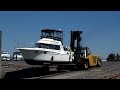 32 Carver boat pulled out of water by forklift