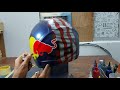 AIRBRUSH HELMET DESIGN RED BULL WITH FLAG AND LIGHTNING..