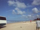 Plane taking off on beach Fraser Island