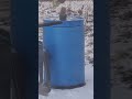 Squirrel eats Popcorn, on top of a rain barrel in the snowy Winter. February 12, 2021 at 17:08
