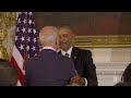 Joe Biden receives a medal but the Throne Room theme is playing