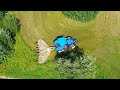 Mulching meadows under a mountain on a slope with a New Holland T7.290 AC tractor + Spearhead 620