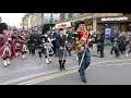 The Massed Highland Pipes & Drums marching through Inverness City centre in Scotland for Charity