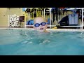 3yo William relaxing next to the wall in the pool