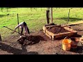 Building brick oven in the middle of the field on a beautiful sunny day 4K