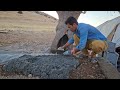 The Asghar family in the heart of the ruins: cementing the platform and setting up the tent