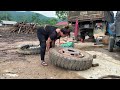 The girl helped replace the truck that had a flat tire and fell off the wheel