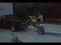 Alec loading his bike and using his tailgate as a ramp. (Fail)