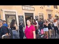 Piazza di Trevi crowded with tourists and the oldest bakery in Rome