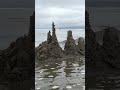 Sandcastle destroyed by waves