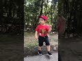 3 yr old inspects his bike before driving