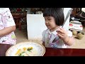 Cute girl Siv chhee help to harvest vegetable for cooking - Family food cooking