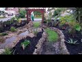 Front botanical garden with pondless waterfall