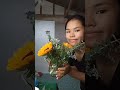 unwrapping sunflower bouquet into flower vase