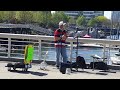 Guy playing a Ukulele at False Creek Vancouver BC