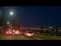 Driving New York City at night.  FDR Dr.  Queensboro Bridge and Long Island City in distance.