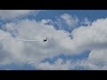 Airplane at airshow doing crazy stunts