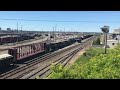 CN Train Departs MacMillan Yard Vaughan Toronto Ontario CN 2864 3877 Passing CN GP9RM 7276 Slug 276