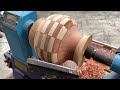 Woodturning - Under the Skillful Hands of the Craftsman, a Unique Vase is Created from Pine Wood