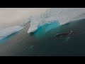 FPV drone cruising among icebergs in Greeenland Fjord