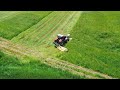 Mowing and raking grass on a slope with Case IH Puma 210, John Deere 8335 R and Krone [2024]