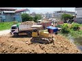 Bulldozer Komatsu D31P with Dump Trucks activities continue in this project