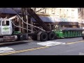 COMICAL DRIVER DOING A DUMPSTER REPLACEMENT MANUEVER ON THE UPPER WEST SIDE OF NEW YORK CITY.