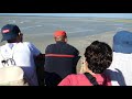 Scary incoming tide & silly tourists on sand at World Heritage Site Mont St Michel Normandy France