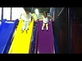 M goes down slide at Stomping Ground