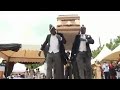 Men dancing with coffin meme