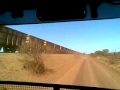Roadtrain meets empty ore train Marandoo, East Pilbara