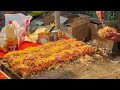 japanese street food - busy okonomiyaki stall お好み焼き