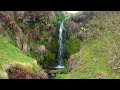 Relax with nature | crystal clear waterfall tumbling over moss covered rocks