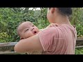 A hard summer day for a single mother and her two children harvesting rice.