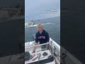 Breaching whale capsizes boat