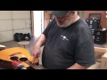 John Reuter removes the neck from a vintage Martin