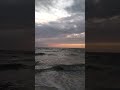 Waves crashing on the beach during sunset