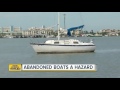 Dozens of abandoned boats are littering Tampa Bay waterways