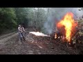 Kendall Gray lighting a forest fire
