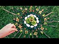 Autumn Sun Mandala making from pebbles, chestnuts, acorns, sticks and more