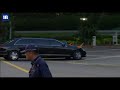 Kim Jong Un's bodyguards run beside his limo in Singapore