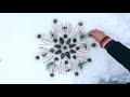 'Snowflake' mandala making from pine tree shoots, cones, fascicle (needles)